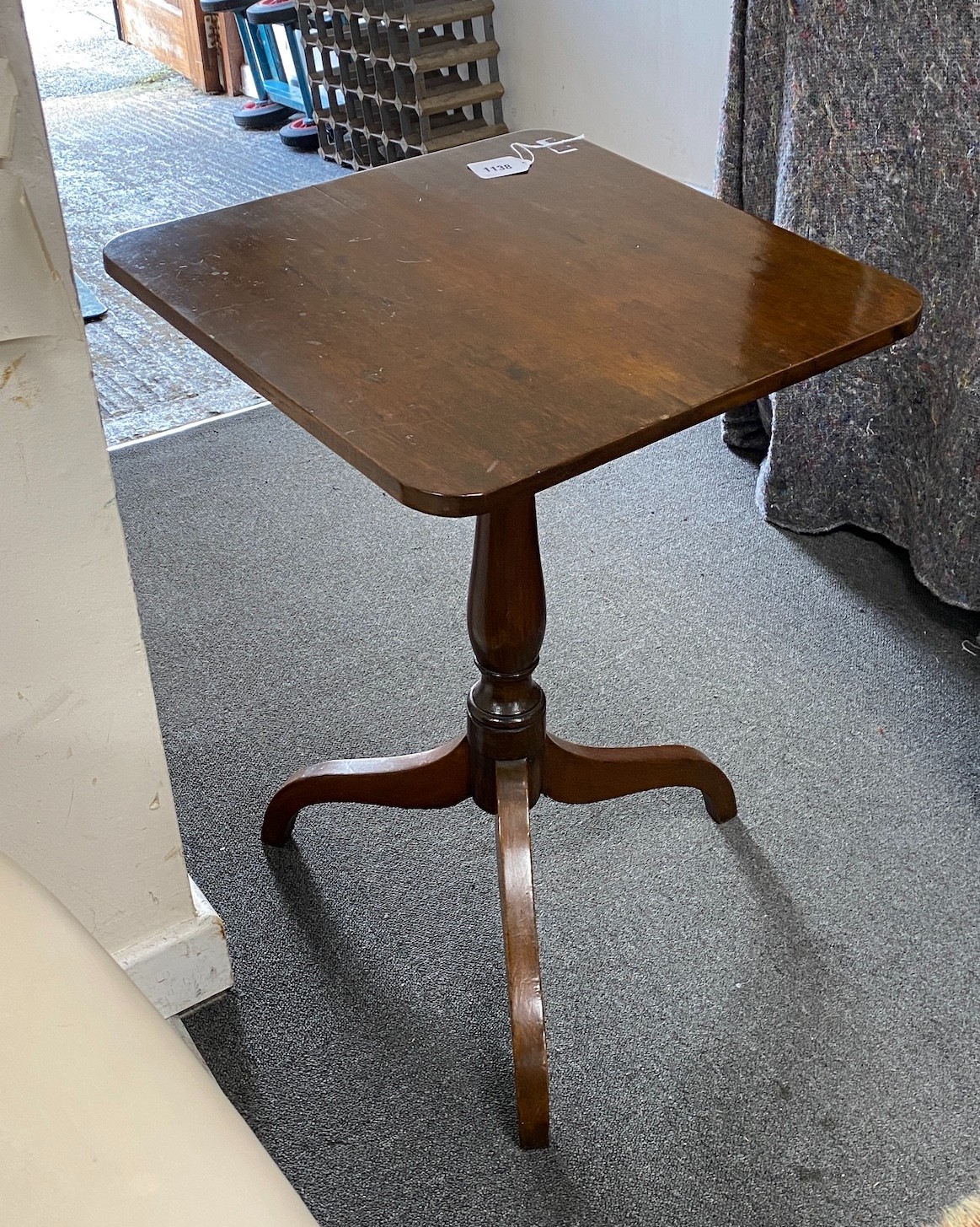 An early 19th century mahogany tilt top tripod wine table and a Victorian circular wine table, larger width 47cm, height 61cm